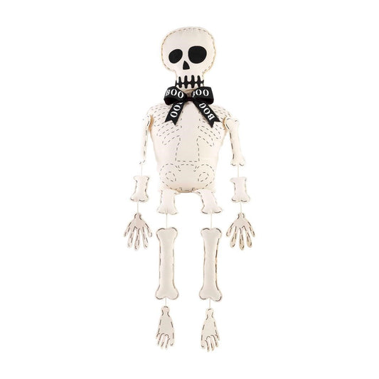 Skeleton plush with "BOO" bowtie on white background.