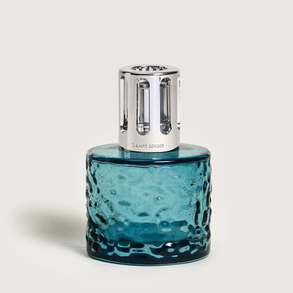Textured blue glass lamp with a silver metallic top.