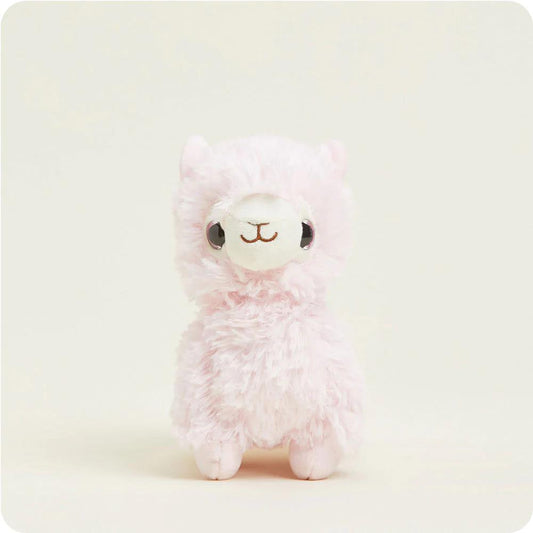 Fluffy pink llama plushie on a light background.