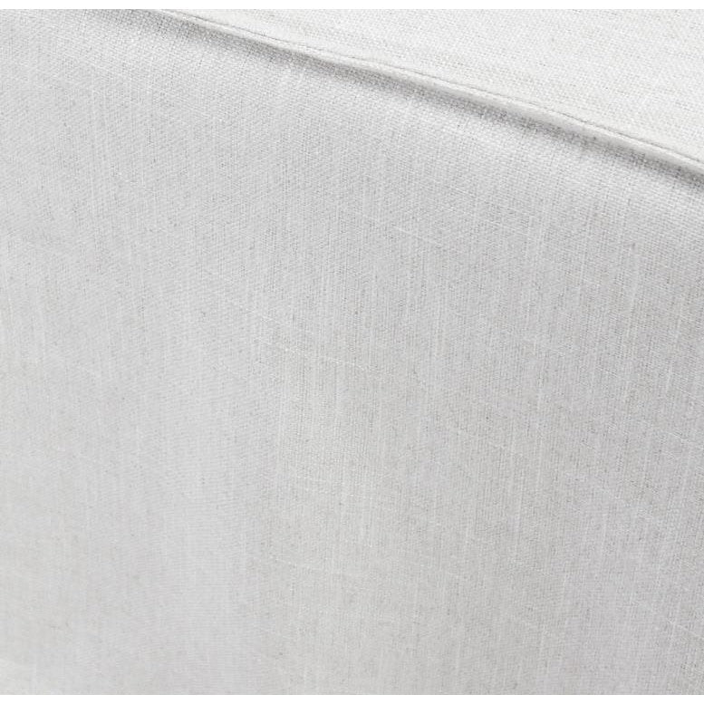 Close-up of a light beige fabric texture with subtle weave.