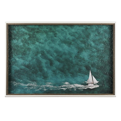 Sailboat gliding through deep teal waters.