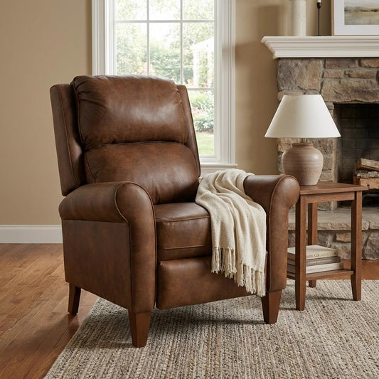 Brown leather recliner with a white throw in a cozy living room setting.