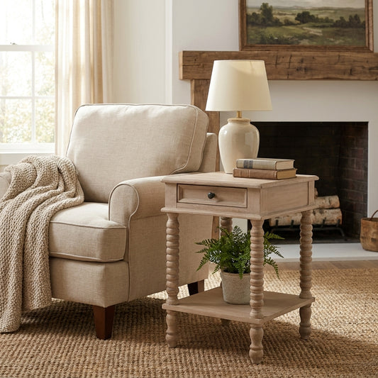 Cozy living room corner with a beige armchair, side table, and lamp.