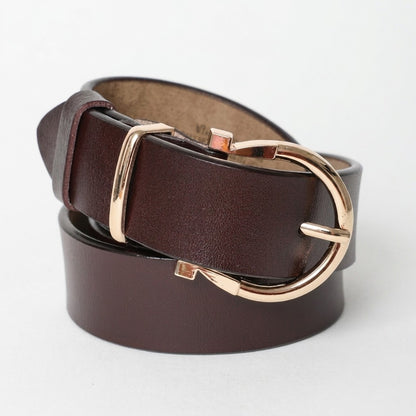 Brown leather belt with a gold buckle, coiled neatly.