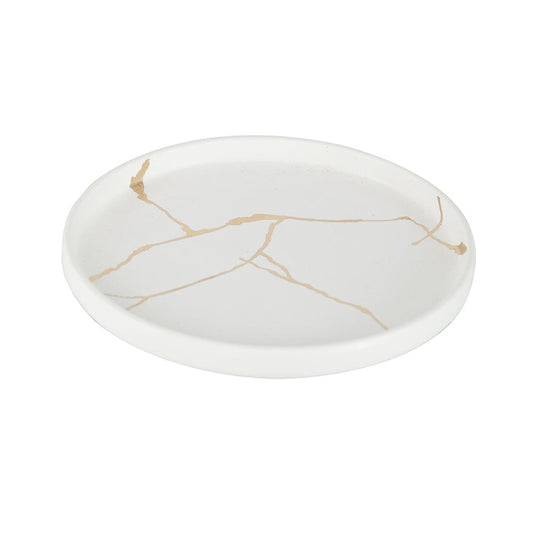 White tray with gold crack-like lines, round and minimalist.
