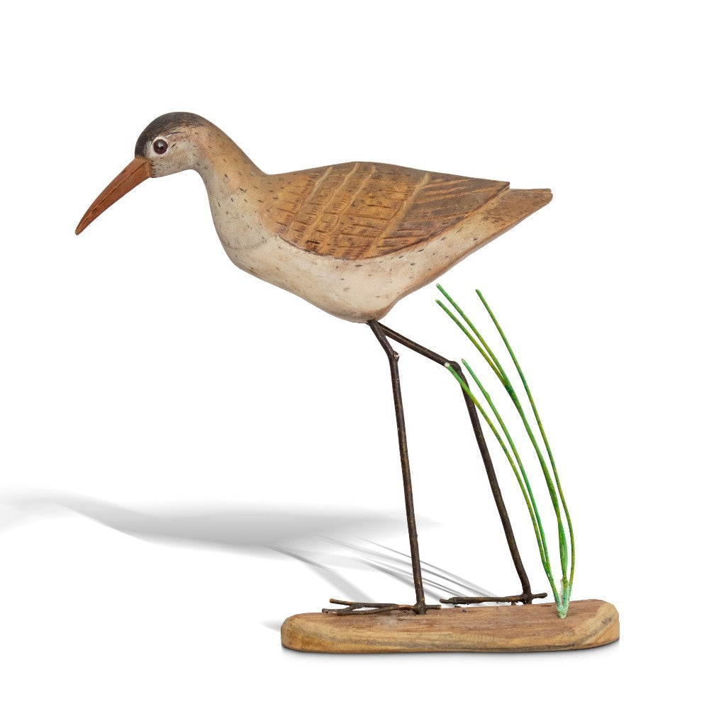 Wooden bird sculpture with long legs and beak.
