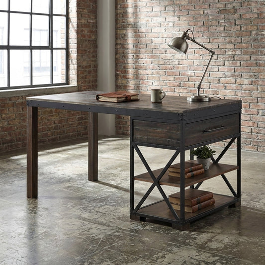 Industrial-style desk in a loft with shelves, a lamp, books, and a mug.