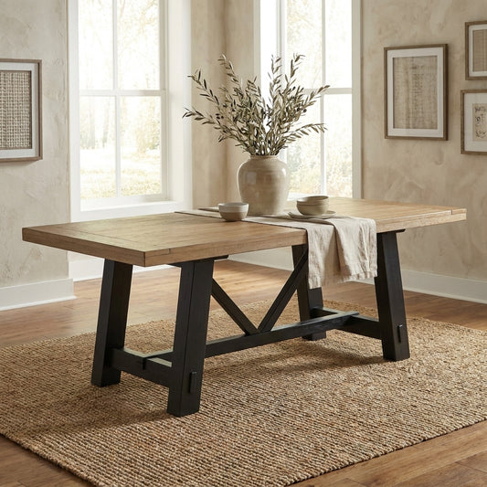 Wooden table with a trestle base and black legs.