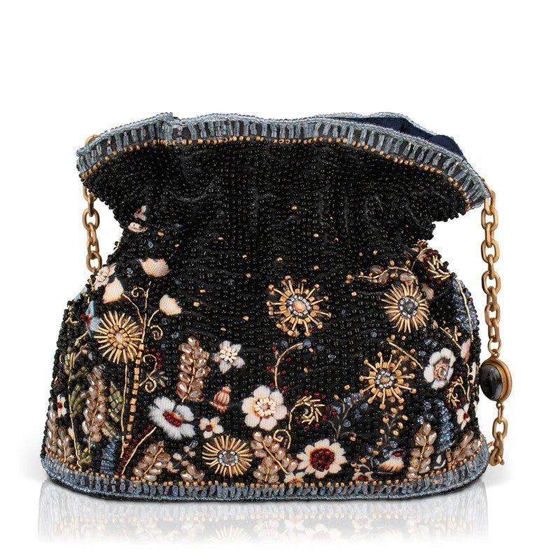 Ornate beaded bag with floral design and chain strap.
