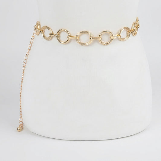 Gold chain belt with round links on a white background.