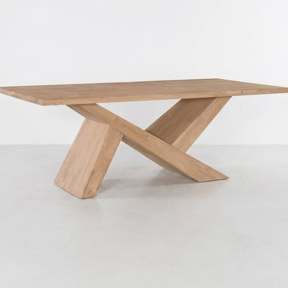 Modern wooden table with an X-shaped base.