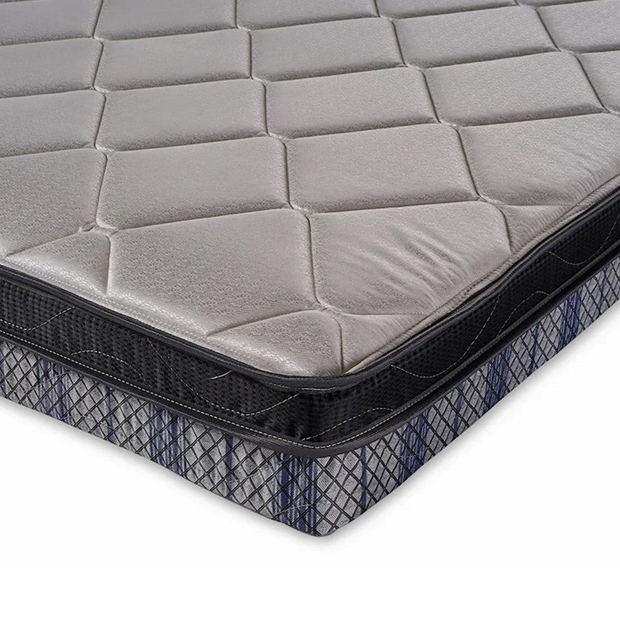 Gray and black quilted mattress corner.