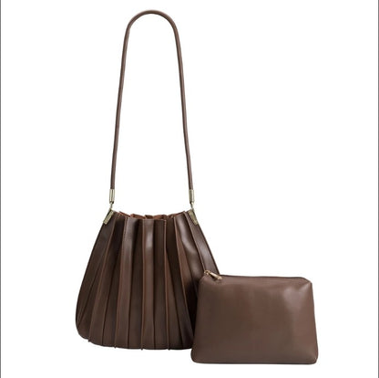 Brown pleated handbag and pouch set with a long strap.