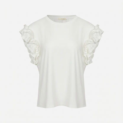 White blouse with ruffled shoulders on a plain background.