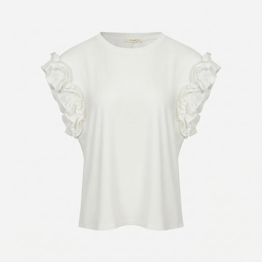 White blouse with ruffled shoulders on a plain background.