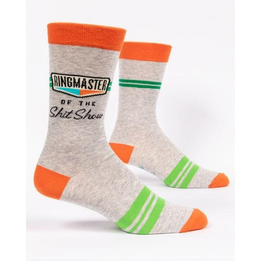 Gray socks with orange and green accents, funny text about a "show."