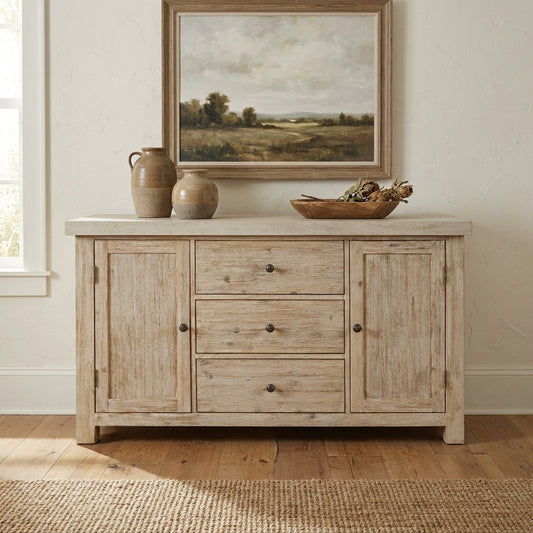 Rustic sideboard with pottery and a landscape painting above.