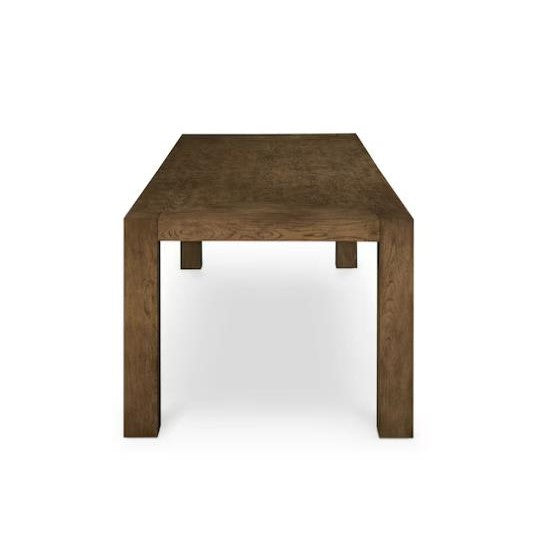 Wooden table with thick legs, viewed from the narrow side.