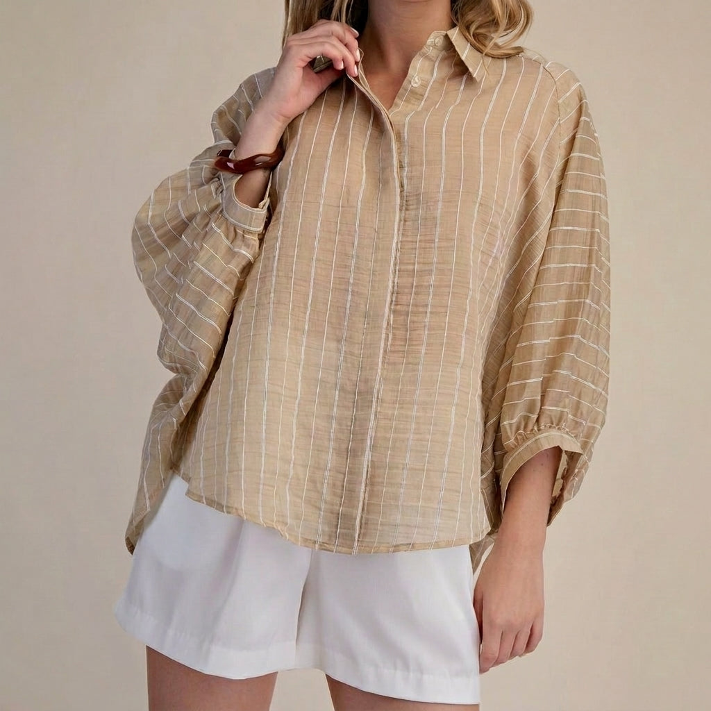 Beige striped shirt and white shorts, minimal style.