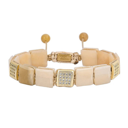 Elegant bracelet with beige square stones and sparkling accents.