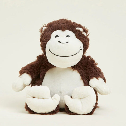 Plush monkey toy with a big smile, brown and white fur.