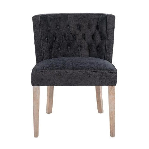 Black tufted chair with wooden legs.