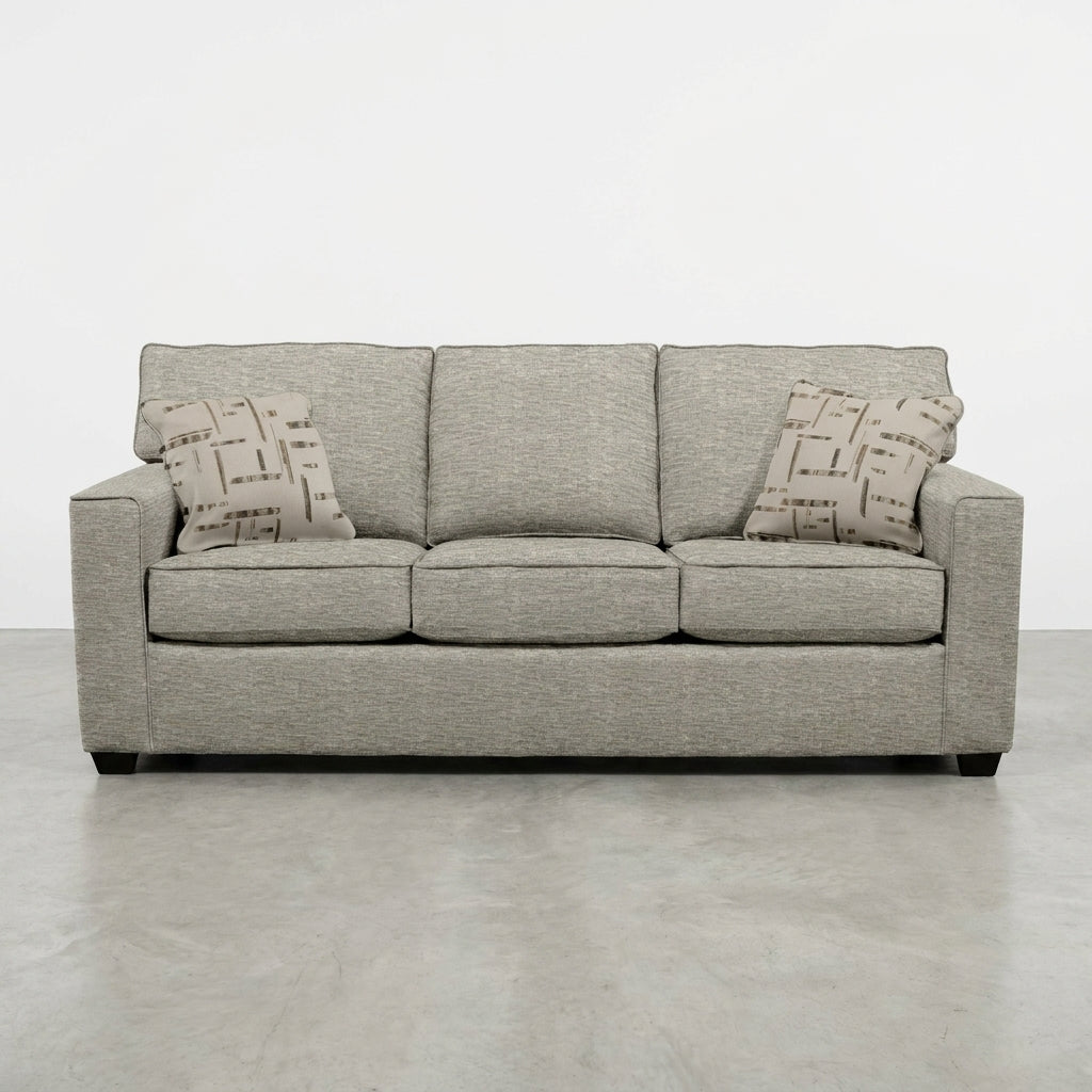Gray sofa with geometric-patterned cushions.