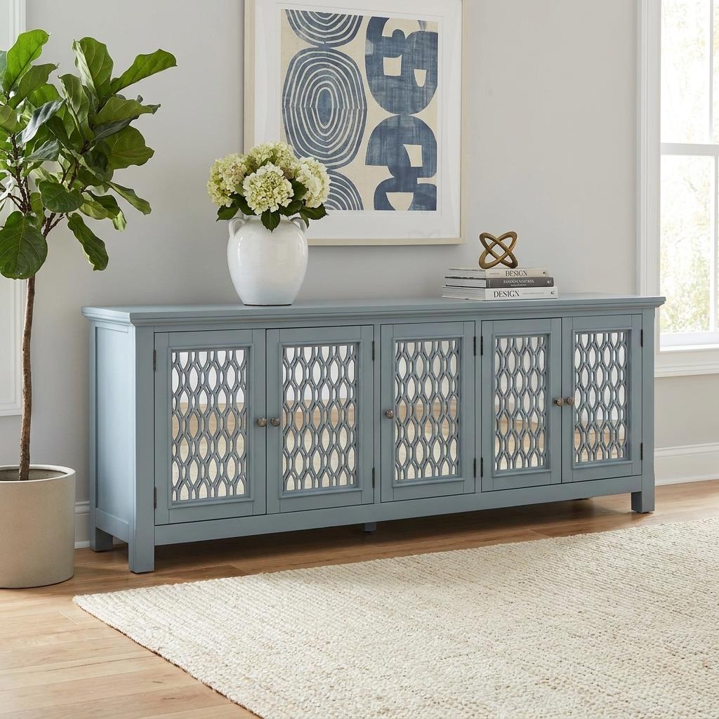 Light blue sideboard with decorative lattice doors.