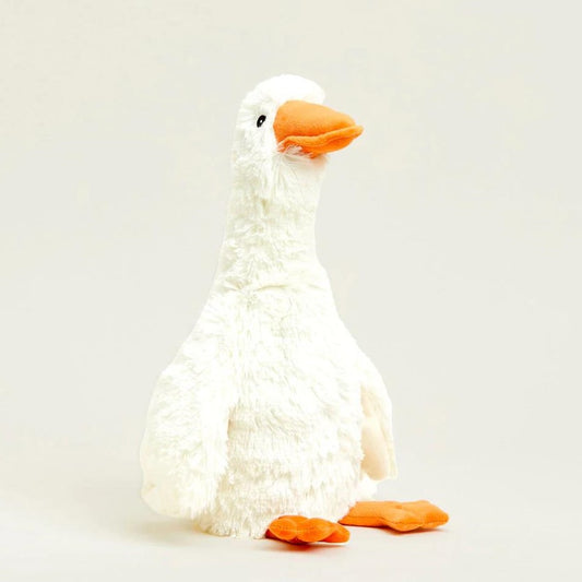 Plush toy goose with white fur and orange beak.