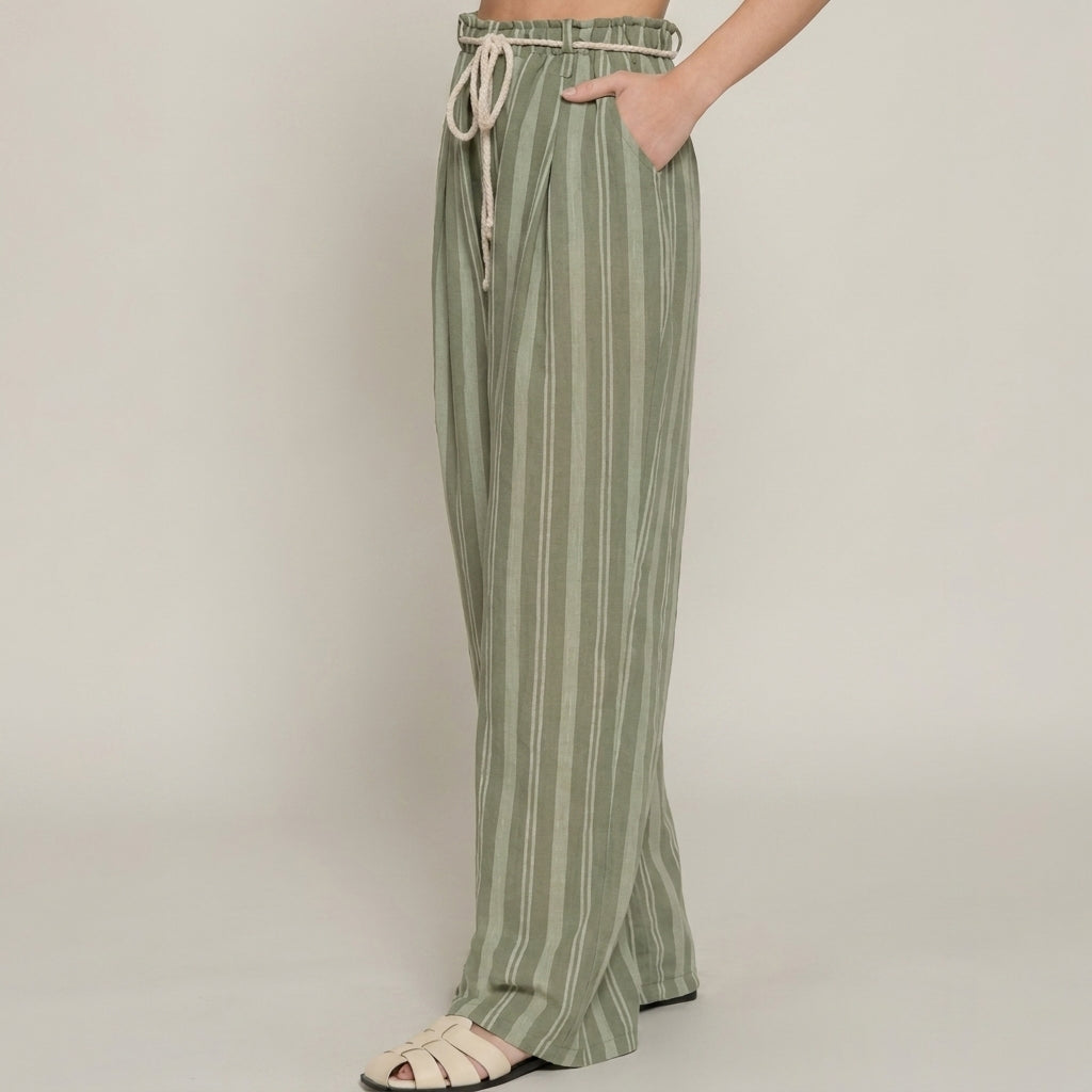 Striped green pants with rope tie and cream sandals.