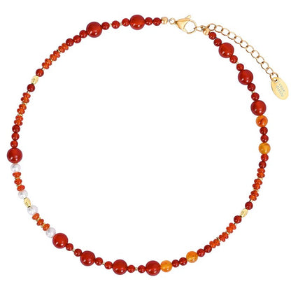 Multicolored gemstone necklace with gold clasp.