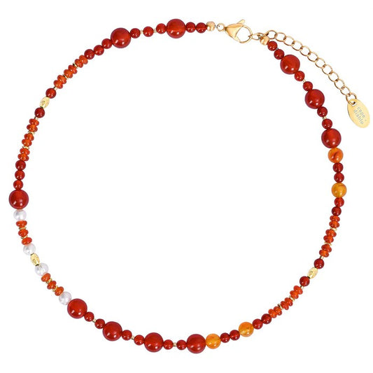 Multicolored gemstone necklace with gold clasp.