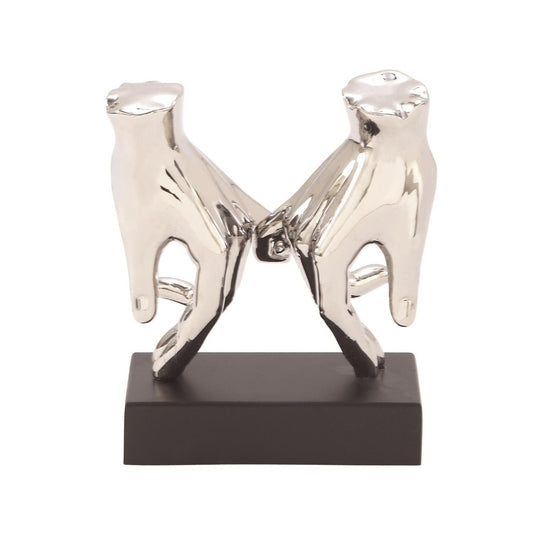 Two silver hands meeting on a dark base.
