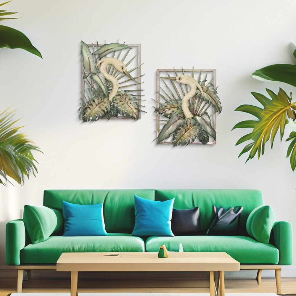 Green sofa, colorful pillows, tropical art on wall, lush plants, wooden table.