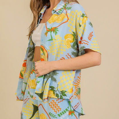 Colorful tropical shirt with lemon and palm tree print.