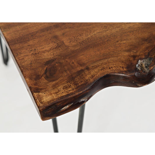 Close-up of a rustic wooden table corner with metal legs.