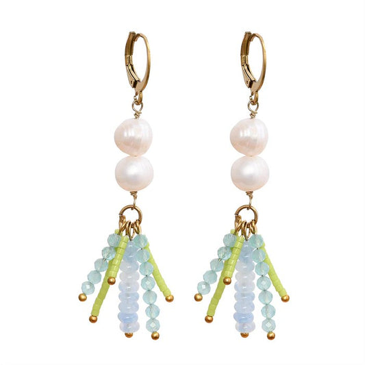 Dangling pearl earrings with colorful bead accents.