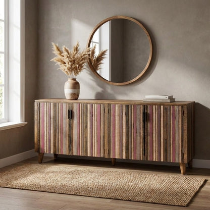 Wooden sideboard with pampas vase, round mirror, natural light.