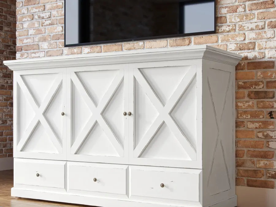 Chatham cabinet bed in white, closed, under a wall-mounted TV
